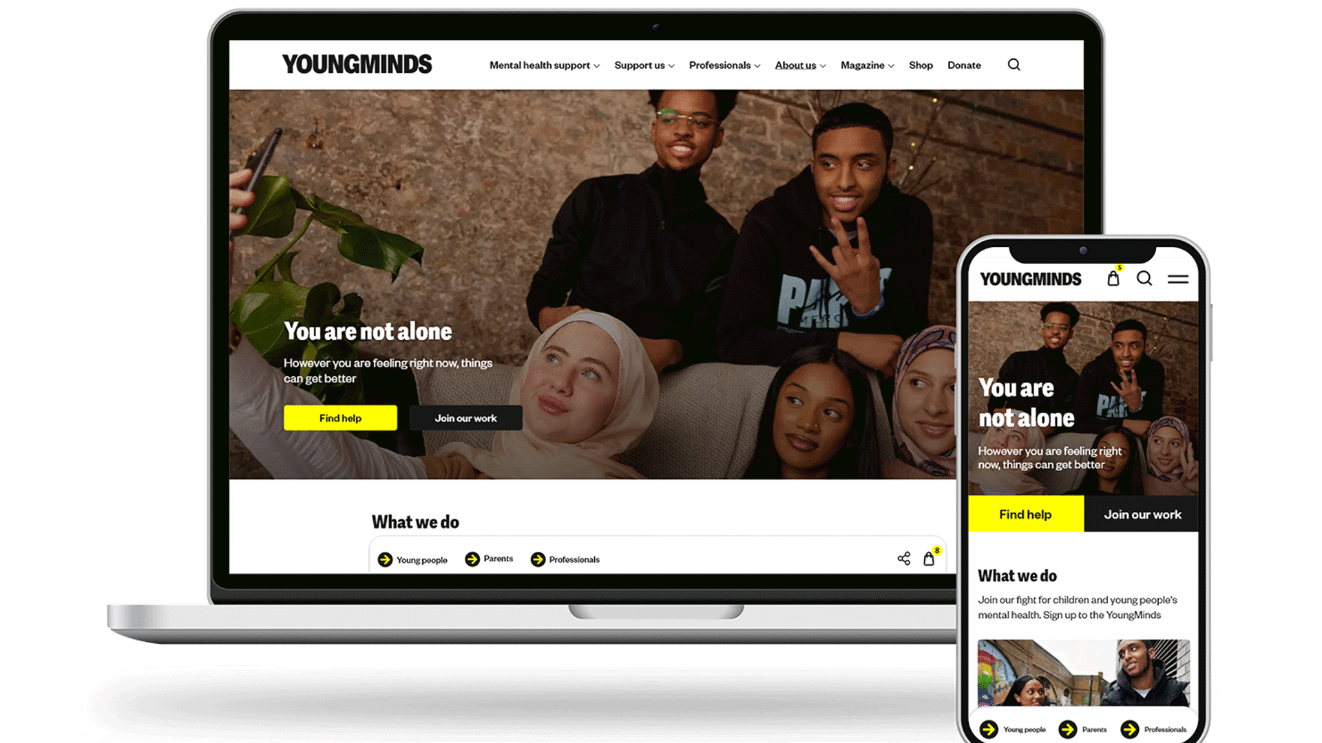 A computer and phone YoungMinds website display, showing a banner with young people.