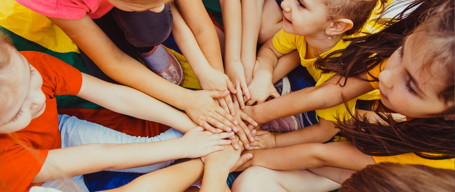 Children standing with hands put together