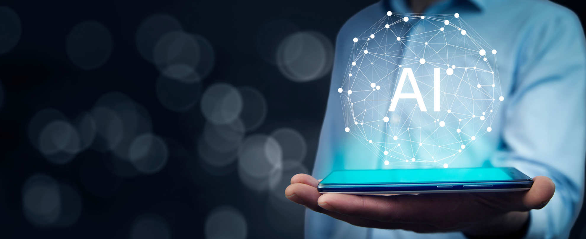 A hand is holding a device with AI bubble