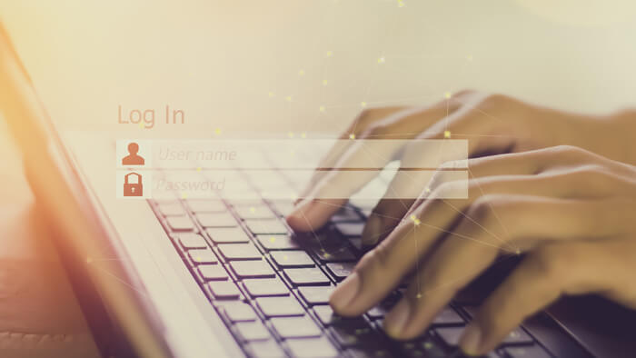 Person typing password and user name