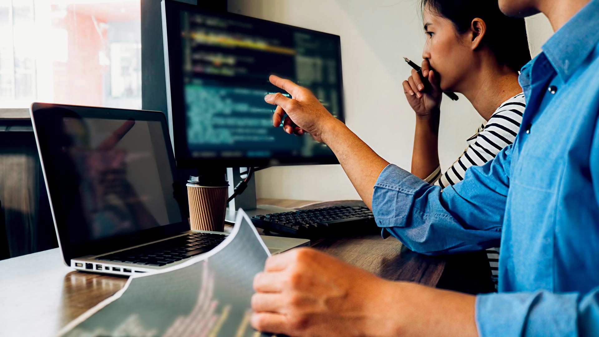 Programmer working in a software development and coding technologies. Software upgrade. Umbraco upgrade.