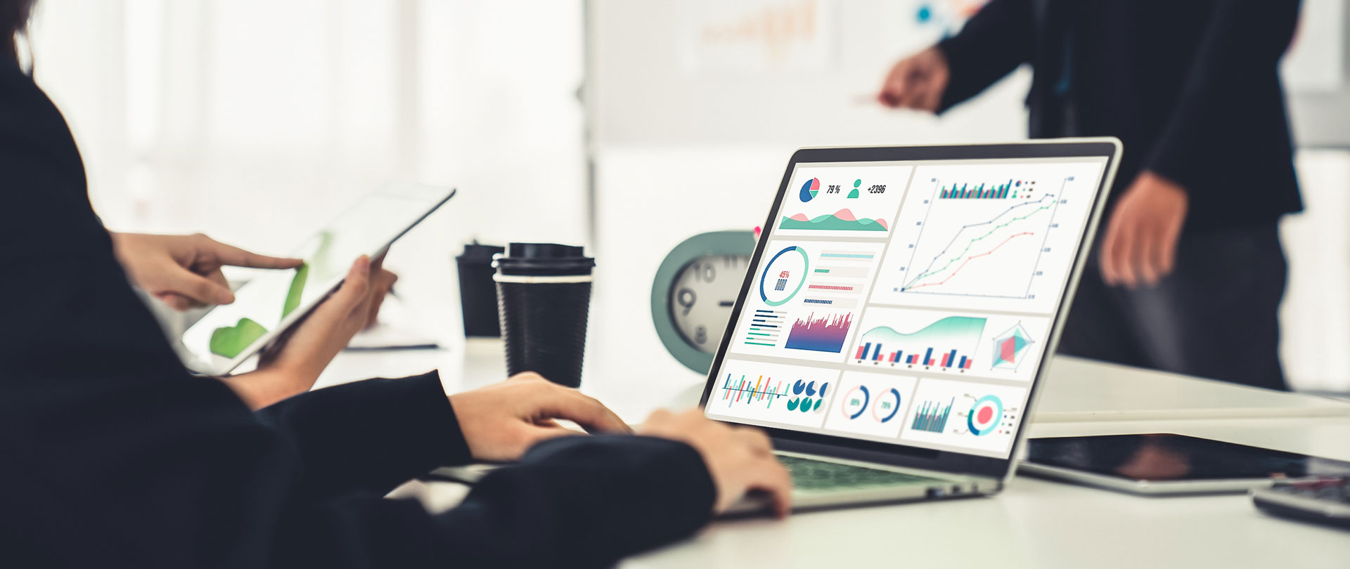 Businesswoman in business meeting using laptop computer proficiently at office for web data analysis