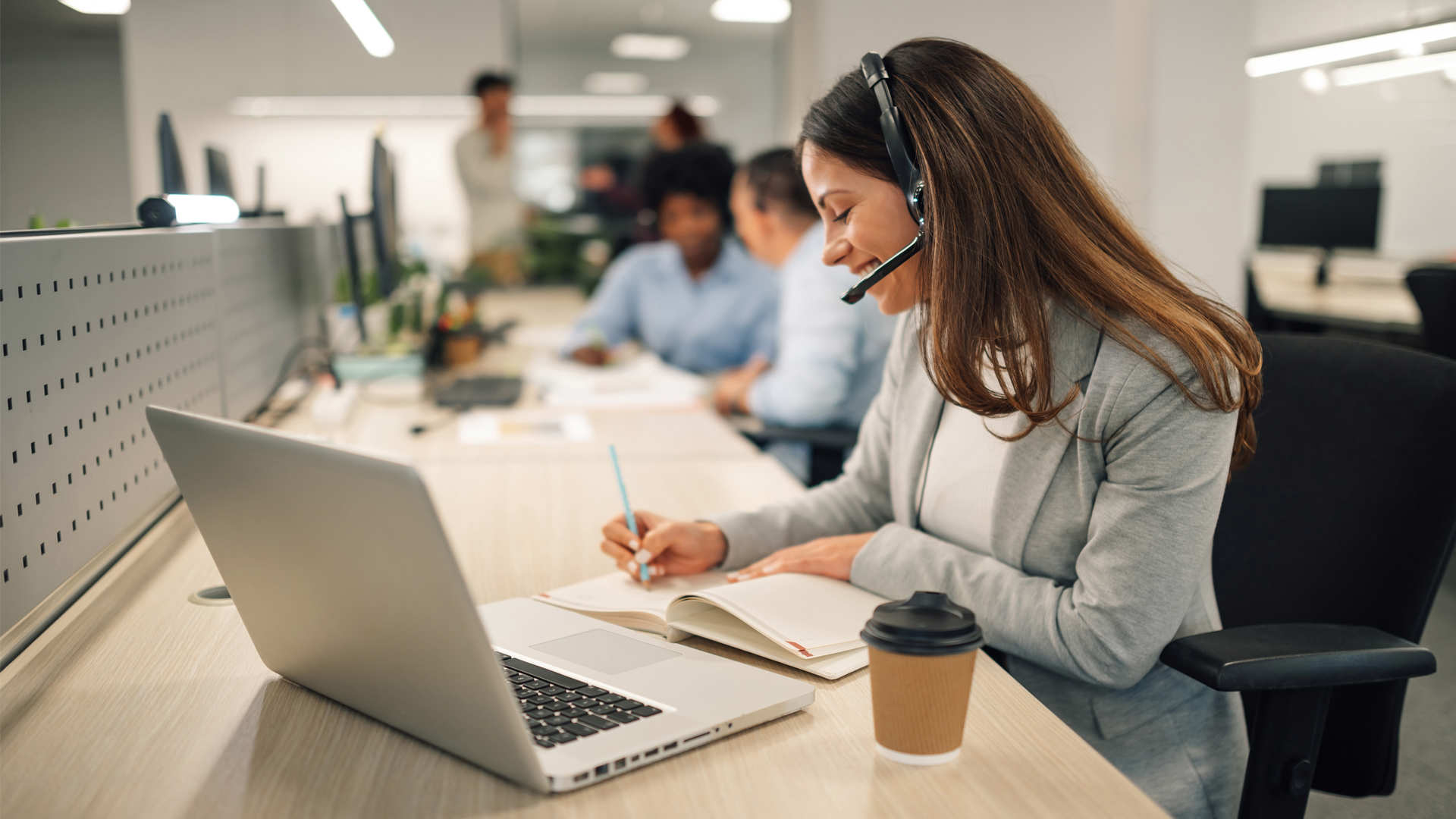 women with headphones talking online