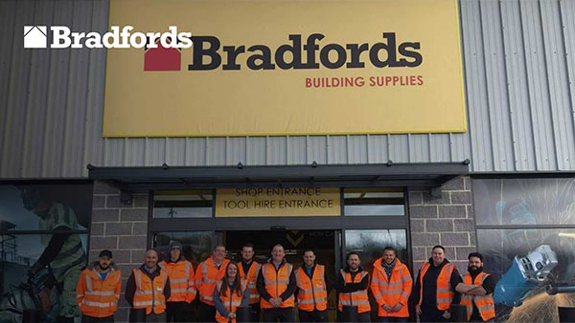 Bradford employees standing in from of a Bradfords supplies shop